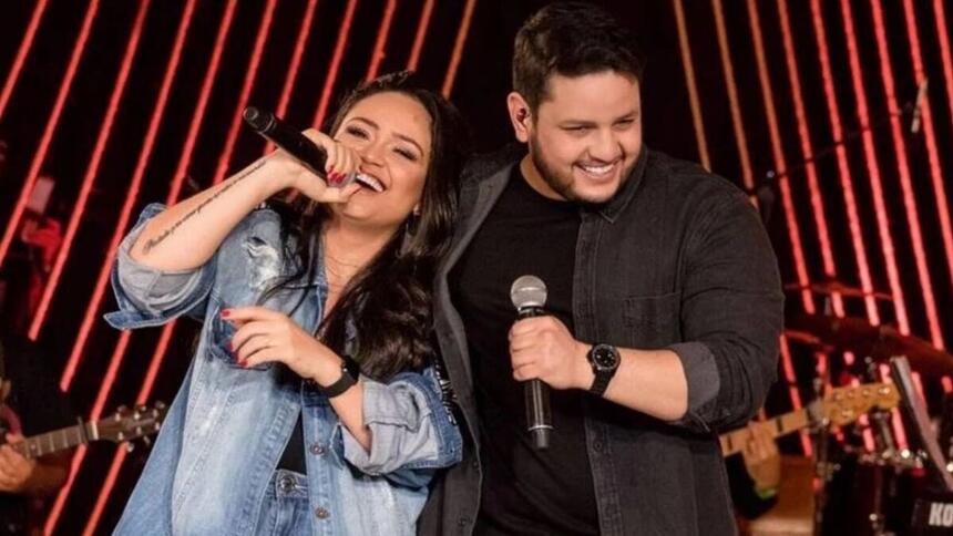 Luiza e Maurílio durante um show