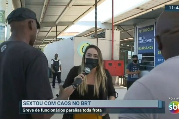 Branca Andrade durante entrada no SBT Rio e sendo intimidade por dois homens