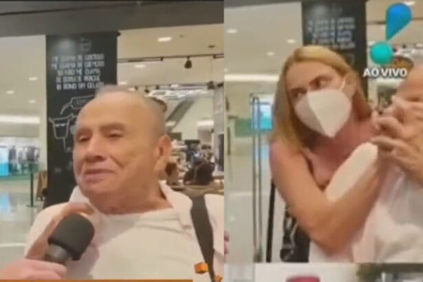 Esposa de Stênio Garcia em aeroporto tapando pondo a máscara durante entrevista para a RedeTV!