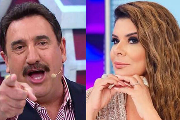 Ratinho apontando pra frente com a mão direita, de blazer azul e camisa branca; Mara Maravilha com as duas mãos do queixo de vestido bege, cabelo solto, durante gravação de programa no SBT