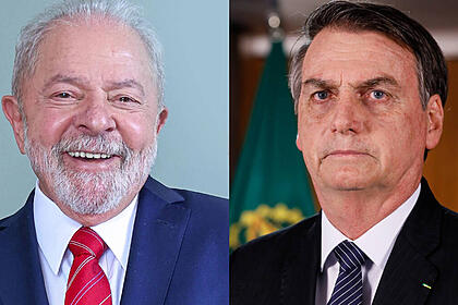 Montagem Lula de blazer azul gravata vermelha sorrindo; Bolsonaro de palitó preto e gravata azul escuro com semblante sério