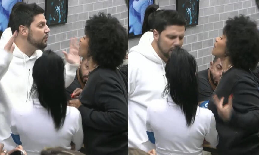 Natália Deodato de camisa preta, cabelo solto, gesticulando na frente de Thiago Servo, na sala de A Grande Conquista