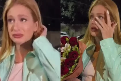 Marina Ruy Barbosa de blazer, chorando, enquanto conversa com fãs