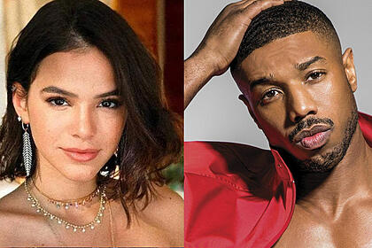 Bruna Marquezine de cabelo curto, com rosto sensual durante ensaio fotográfico; Michael B Jordan de jaqueta vermelha, com a mão na cabeça durante ensaio fotográfico para revista