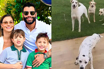 Andressa Suita e Gustavo Lima sorrindo abraçados com os filhos durante festa de aniversário; cachorros adotados por Gusttavo Lima e Andressa Suita