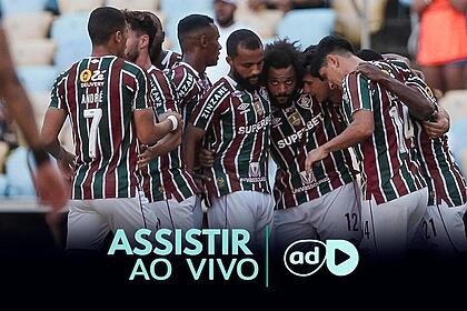 Jogadores reunidos e abraçados na arte onde assistir ao jogo Cerro Porteño x Fluminense pela Libertadores