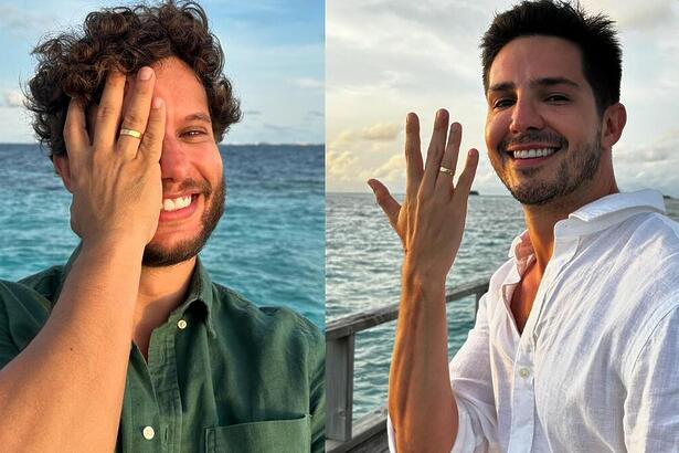 Igor Cosso e noivo Heron Leal mostrando as alianças de noivado