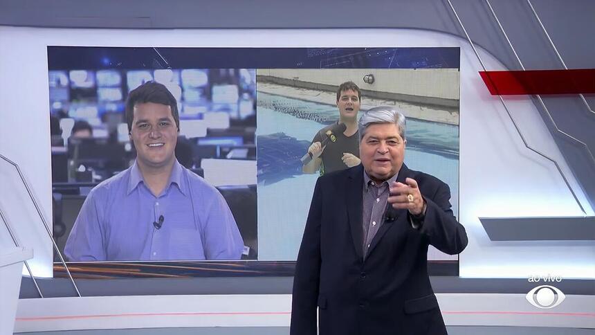 Felipe Garraffa no telão do Brasil Urgente conversando com o apresentador José Luzi Datena