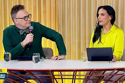 Felipeh Campos e Márcia Dantas sendo na bancadas do Primeiro Impacto