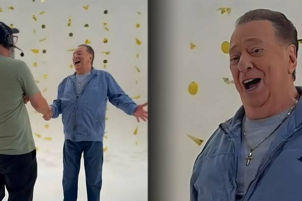 Raul Gil canta e abre os braços na gravação da vinheta de ano novo do SBT