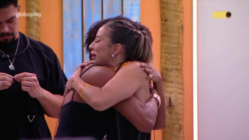 Renata chora abraçada a Aline na porta de entrada do BBB 25