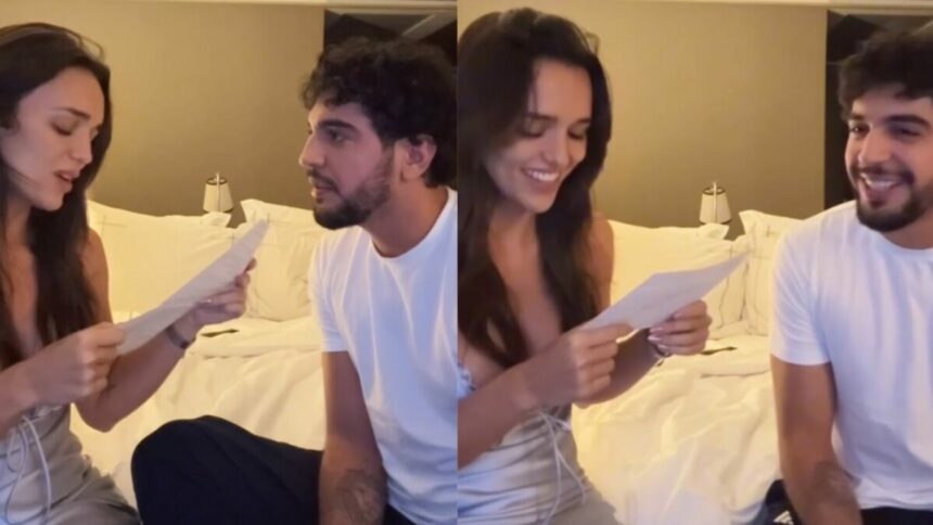 Rafa Kalimann e Nattan, lendo uma carta, em trecho do vídeo anúncio de gravidez