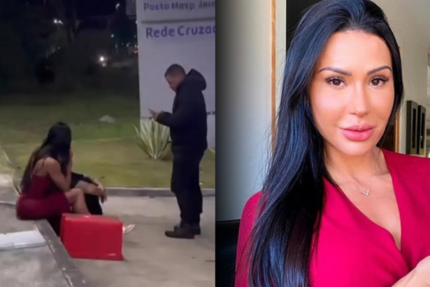 Gracyanne Barbosa sentada na calçada de uma rua sendo atendida por um policial após assalto no Rio de Janeiro