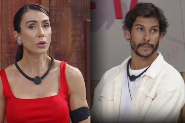 Montagem de Michelle Barros (vestido vermelho, com colar preto no pescoço) com uma expressão séria e do participante Shia (camisa branca, jaqueta bege) olhando para o lado, ambos nos estúdios do reality show A Fazenda.