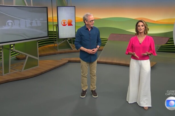 Nélson Araújo e Helen Martins caminham no cenário do Globo Rural