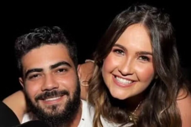 Henrique e a esposa Amanda em foto posada abraçados