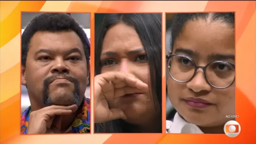 Babu Santana divide tela com Chaiany, que chora, e Milena que olha sério na noite de eliminação do 8º Paredão do BBB 26