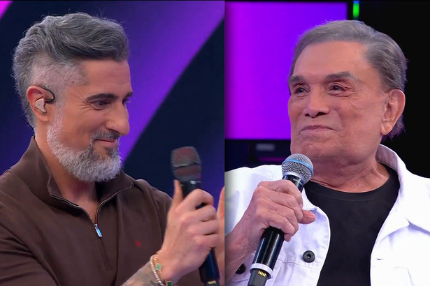 Marcos Mion aplaude Dedé Santana que olha para o apresentador emocionado no palco do Caldeirão