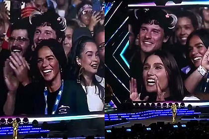 Shawn Mendes, com Xuxinha na cabeça, surge no telão do show de Xuxa ao lado de Sasha e Bruna Marquezine