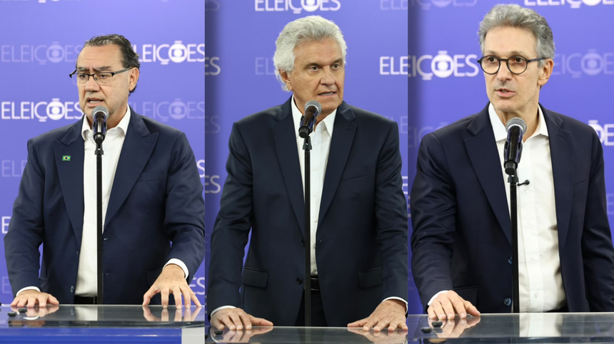 Augusto Cury, Ronaldo Caiado e Zema em pé no púlpito do Debate Globo